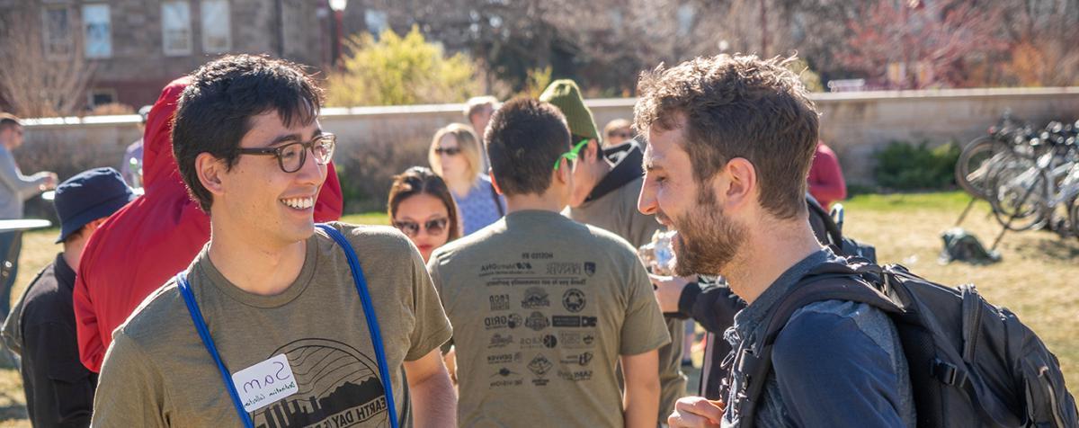 students talking at event outside